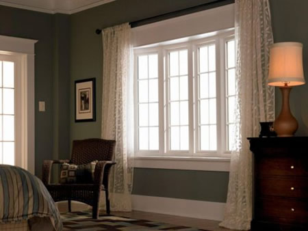 Double hung window in a media pa bedroom with top sash venting